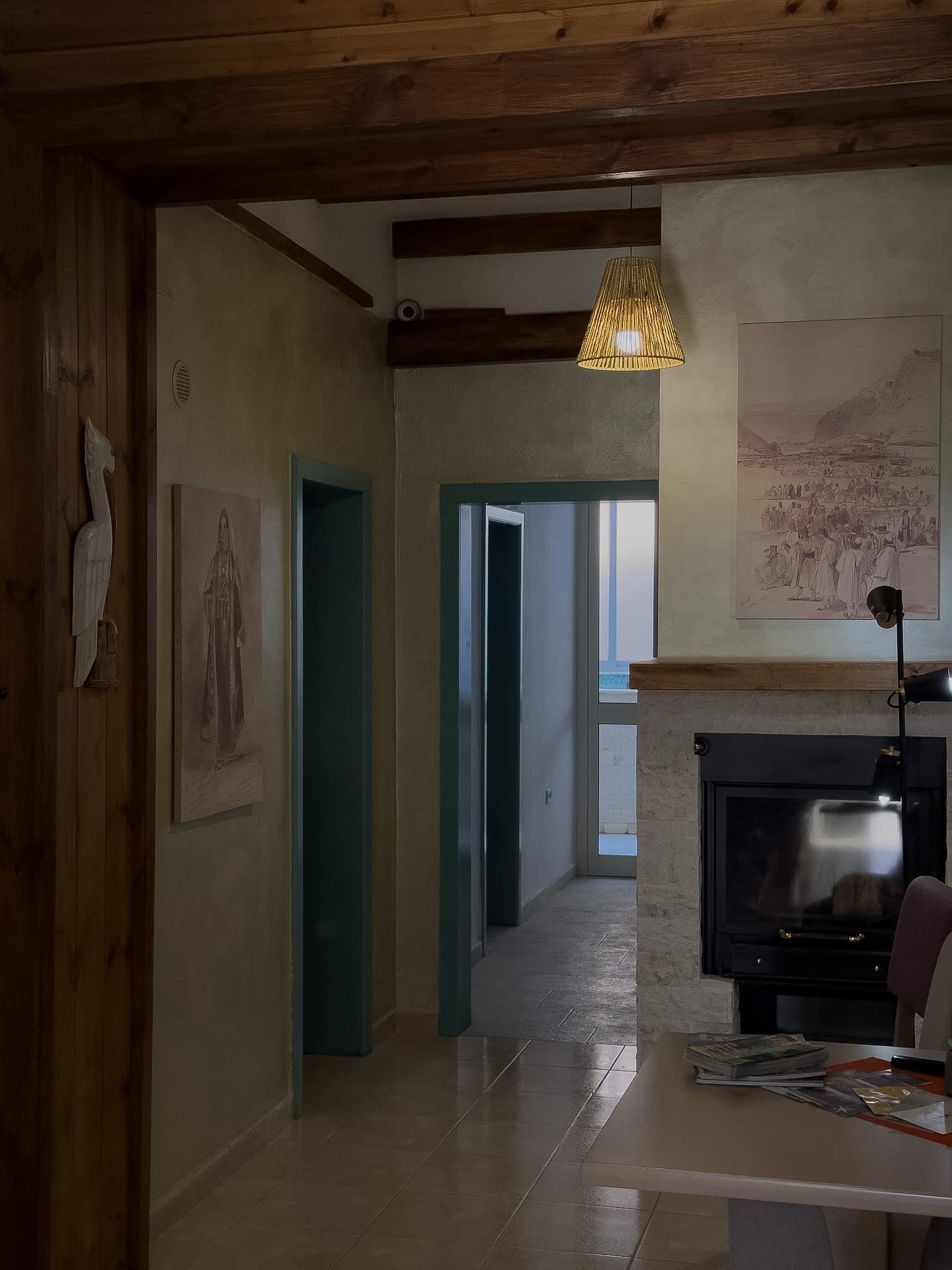Warm interior lounge corridor with coastal artwork